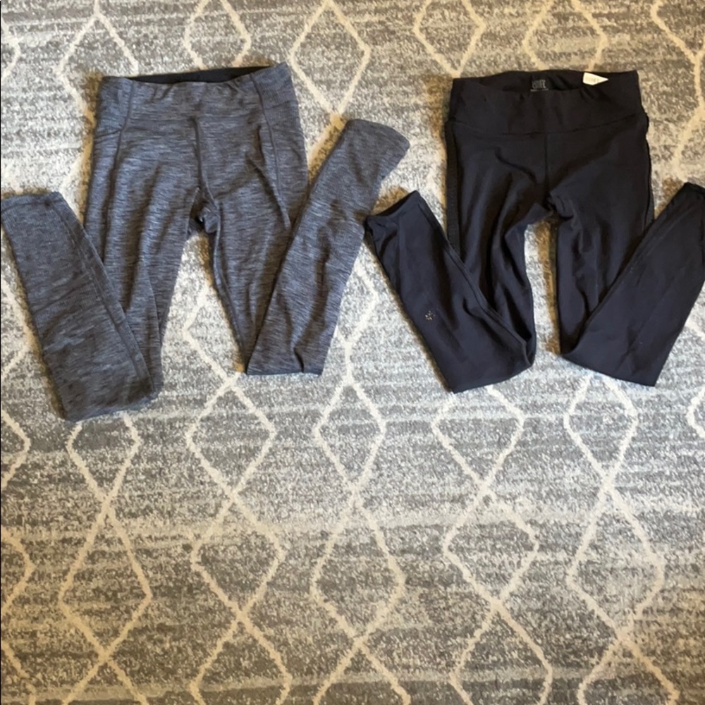 2 pair of athleta girl leggings, a black and grey